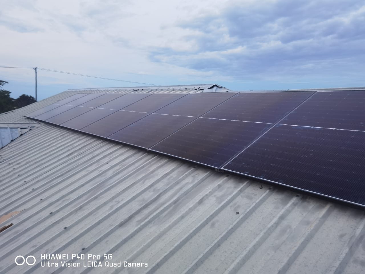 Large solar panel installation on a metal roof