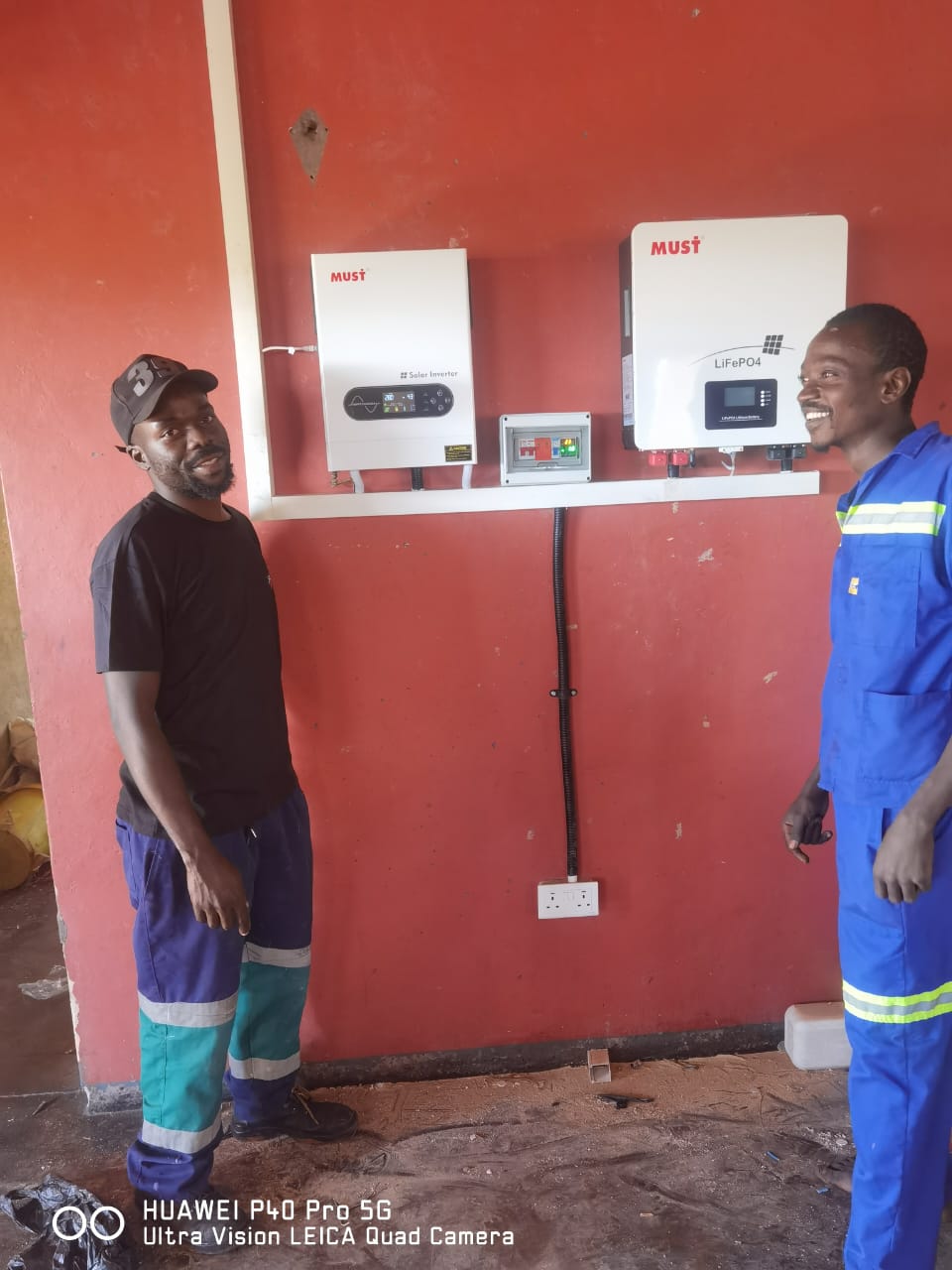 Royal Current technicians inspecting an inverter installation